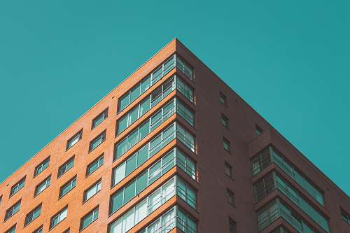 city brown concrete high-rise building urban