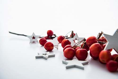 holiday red cherries and white star decorations xmas