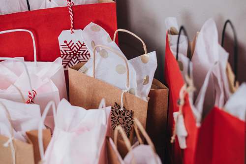 holiday shallow focus photography of paper bags gift