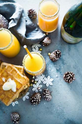 christmas orange liquid on clear drinking glasses breakfast