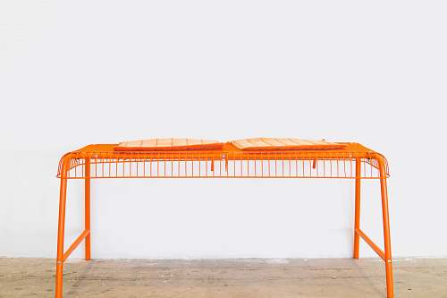 orange orange steel scaffolding on brown surface chair