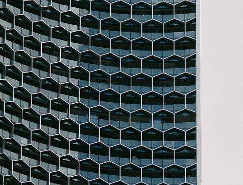 architecture A building with glass hexagon shaped windows pattern