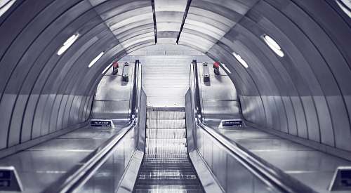 tunnel gray escalator stairs