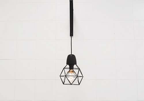 white pendant lamp hanged on white room light fixture