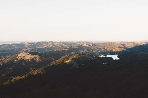 nature aerial view of hills during daytime crest