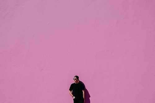 human man in black shirt on pink background people