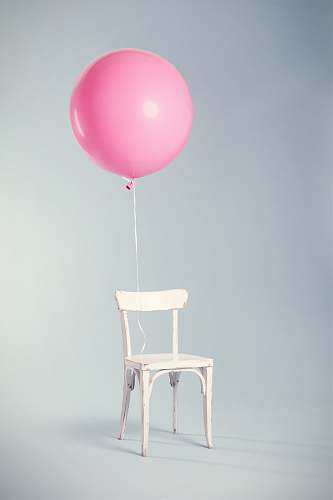 chair pink balloon tied on white wooden chair furniture