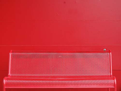 background red metal bench wall