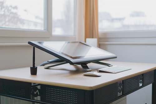 desk black all-in-one computer on table workspace