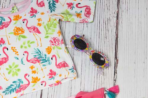 friendswood white and multicolored crew-neck shirt near sunglasses united states