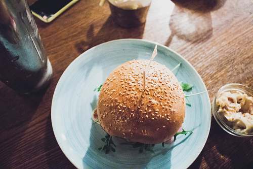 bowl baked bread on round teal plate london
