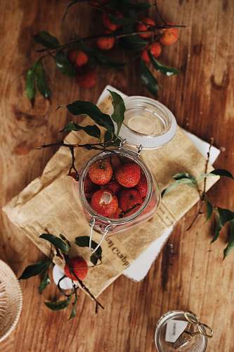 meal flat lay photography of jar of red fruits dish