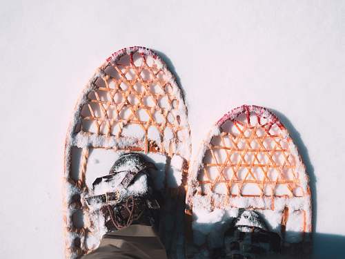 snow person wearing snow shoes snow shoe