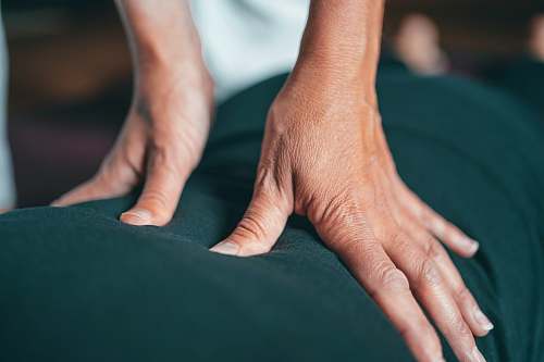  persons hand on black textile 