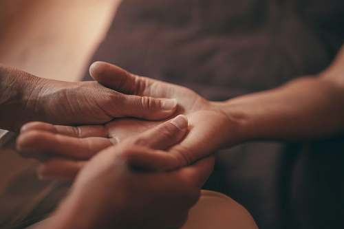  persons hand on brown textile 