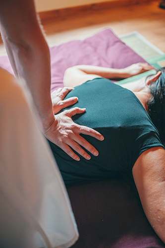 person woman in black tank top lying on bed patient