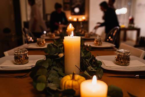 human lighted candles on table person