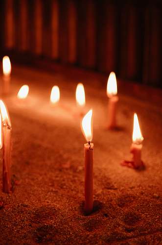 fire selective focus photo of lit candles flame