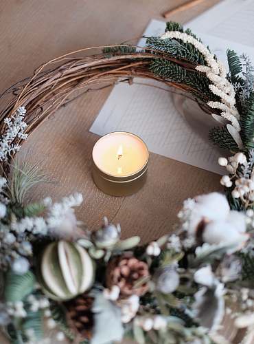 wreath tealight candle on brown surface candlelight