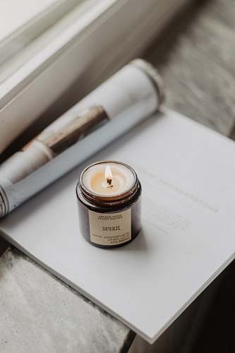 text white and black votive candle grey