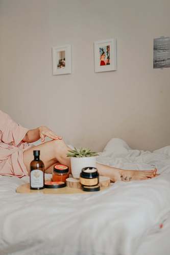 bed cosmetic bottles on tray furniture