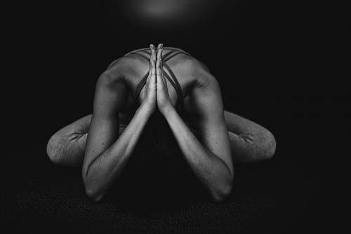 person grayscale photo of naked man arm