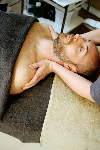 person man lying on bed massage