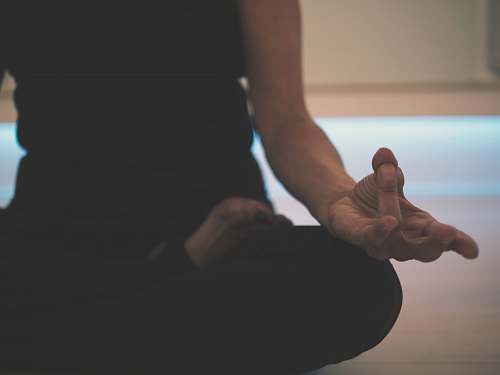 person person doing yoga on floor yoga