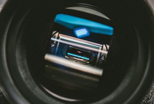 a camera lens with a blue light on it