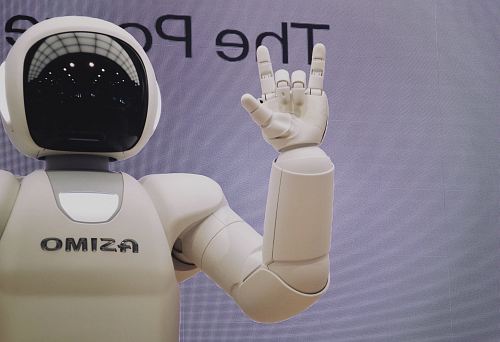 Asimo robot doing handsign