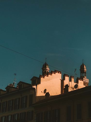 beige concrete buildings under green skies