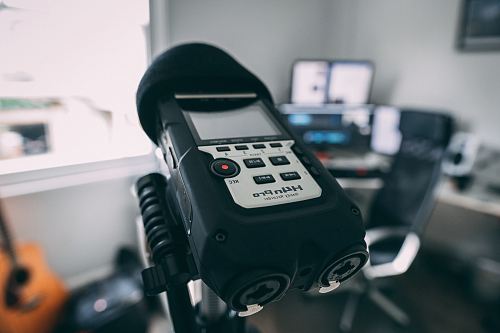 black and gray H4nPro digital device on stand