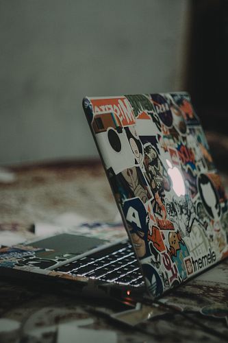 black and white laptop on floor