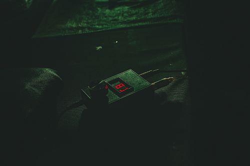 black digital device with the number 87