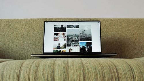 black laptop computer on couch