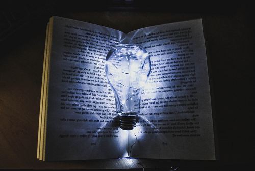 bulb with string lights on book page
