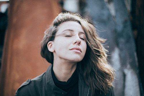 closeup photo of woman wearing black top