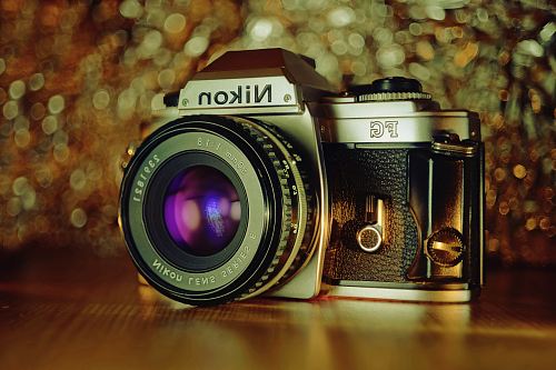 focus photography of black and gray Nikon FG camera