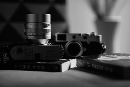 grayscale photography of DSLR camera