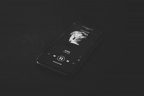 grey smartphone playing music