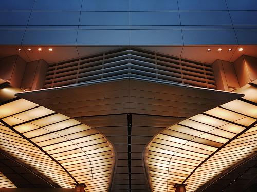 low angle photo of white ceiling structure of a building