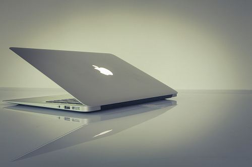 MacBook Air on top of white table