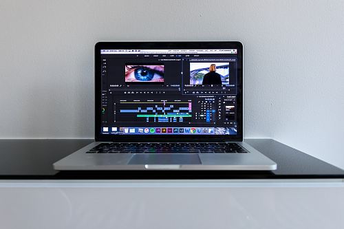 MacBook Pro on black desk