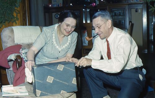 man and woman holding black box