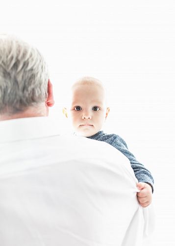man carrying a baby