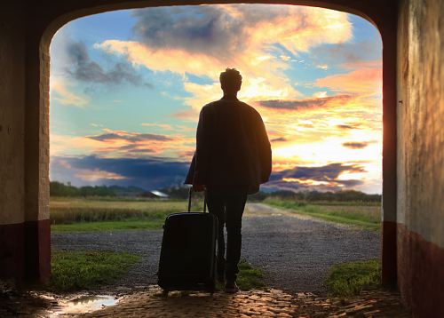 man holding luggage photo
