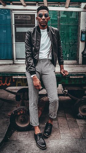 man in black jacket posing