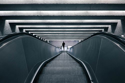 man on escalator turned on
