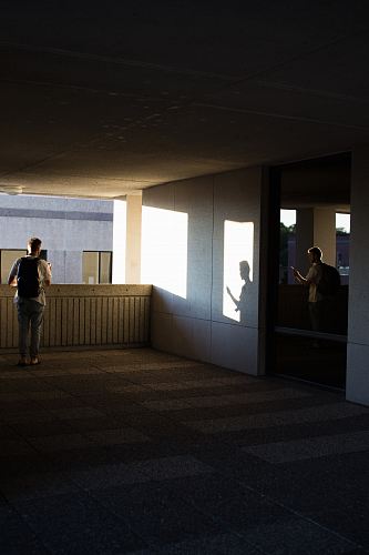 man standing on concrete flooring