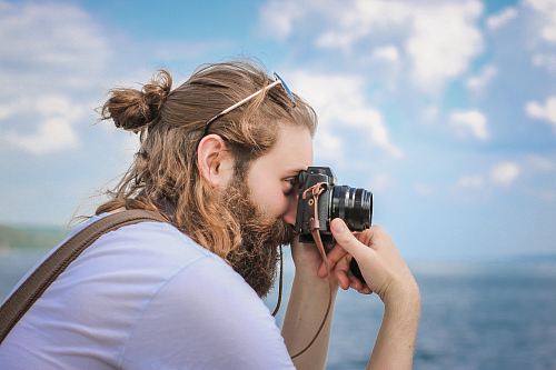 man taking a picture during daytime
